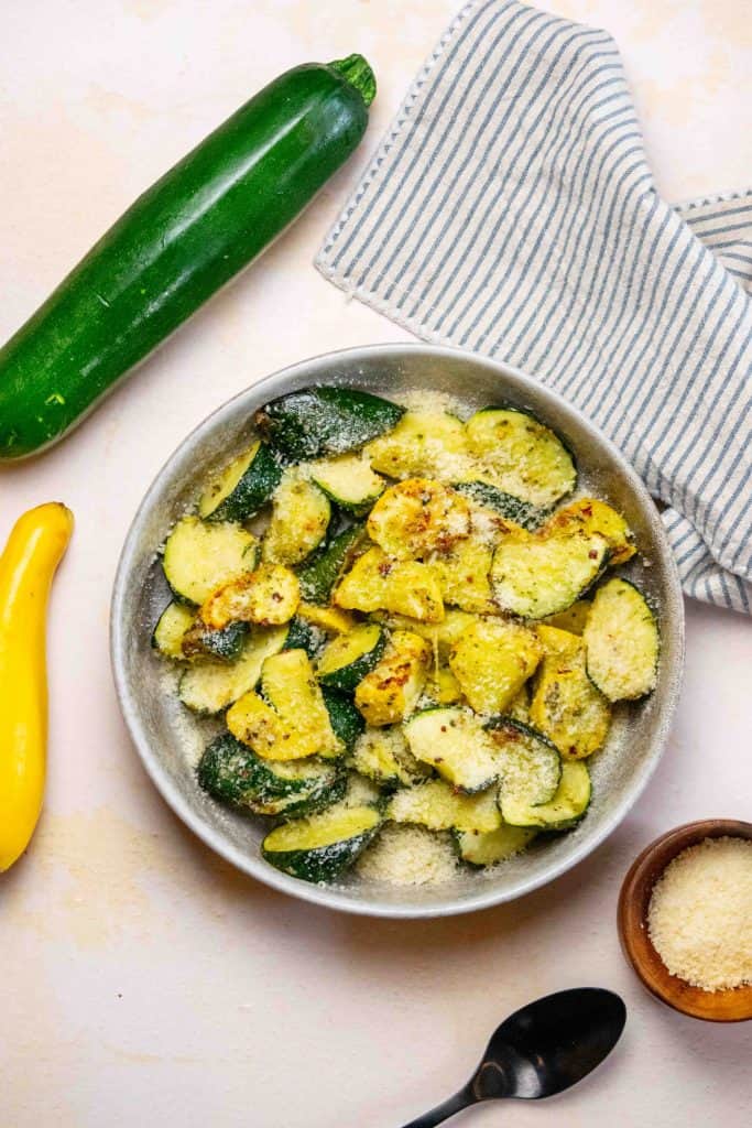 transfer to a bowl, add remaining parmesan, and serve
