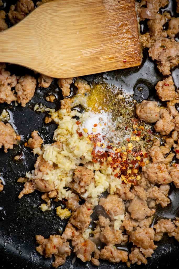 Add garlic and spices. Cook 1 minute, stirring occasionally. 