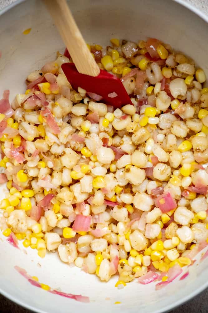 Transfer dressing to a large bowl with the hominy, and toss to coat