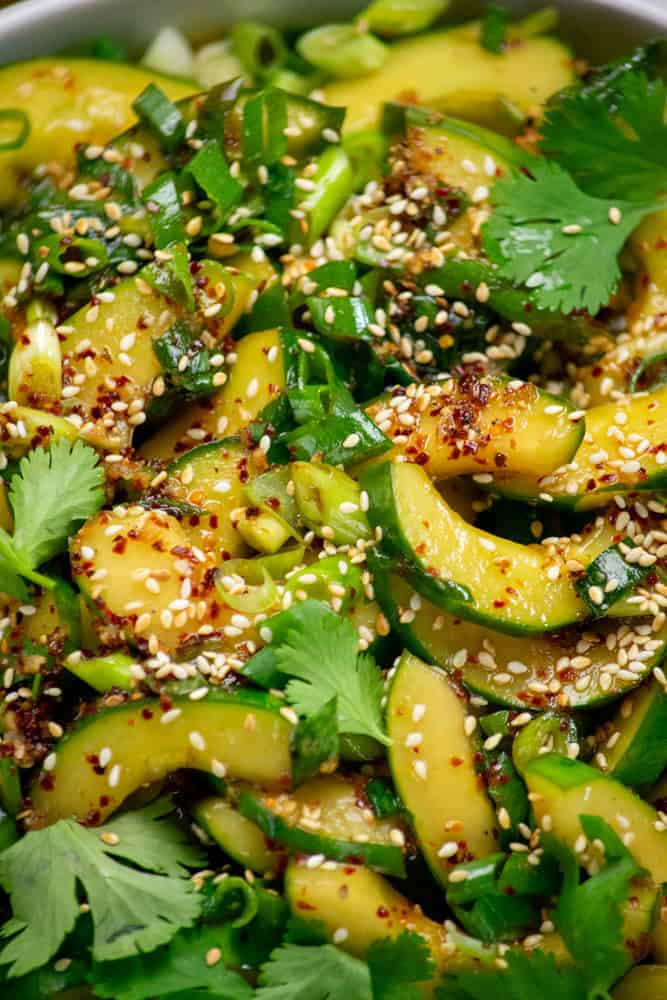 toss to coat, and garnish with toasted sesame seeds and cilantro