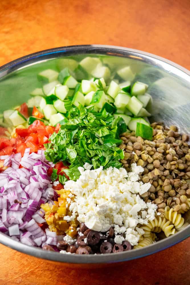 add cooked cooled pasta and remaining salad ingredients to a large bowl