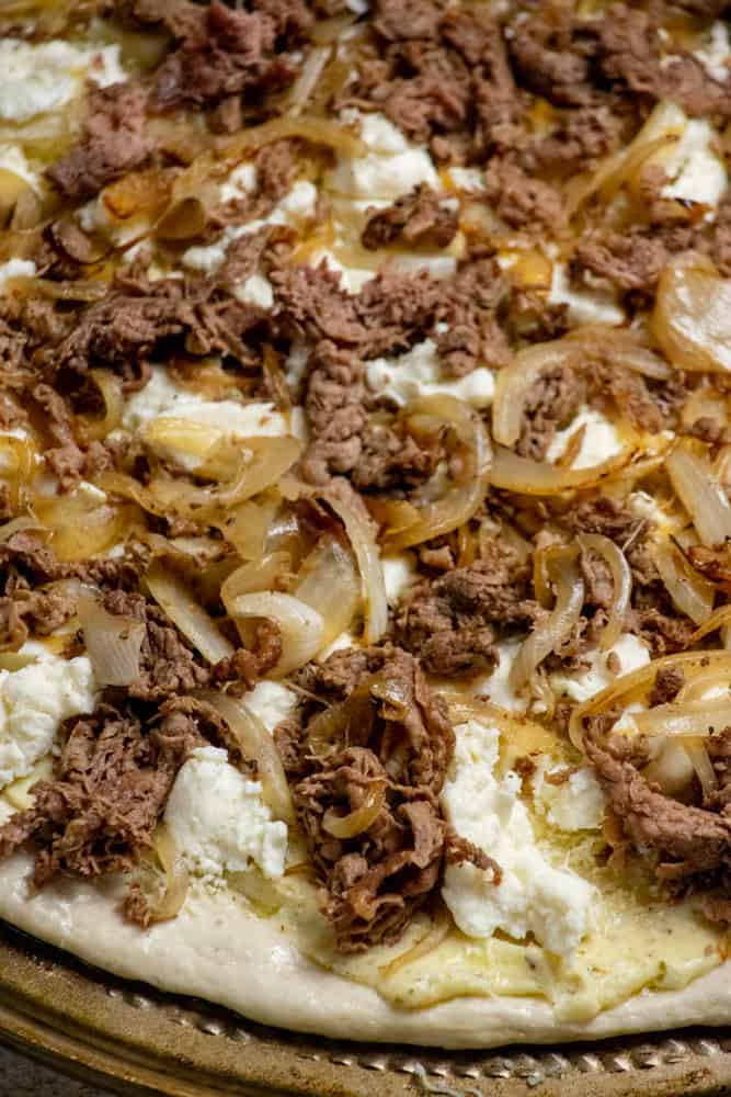 add shaved steak and onions