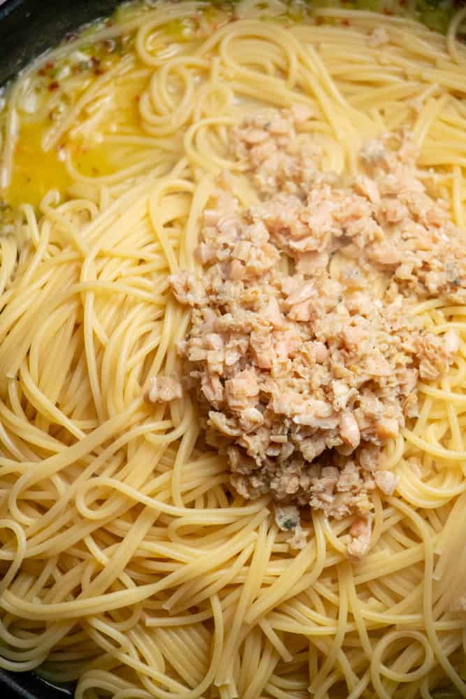 add drained pasta and clams, and toss to coat
