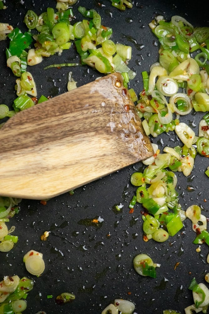 Cook scallions, garlic, and red pepper flakes in olive oil