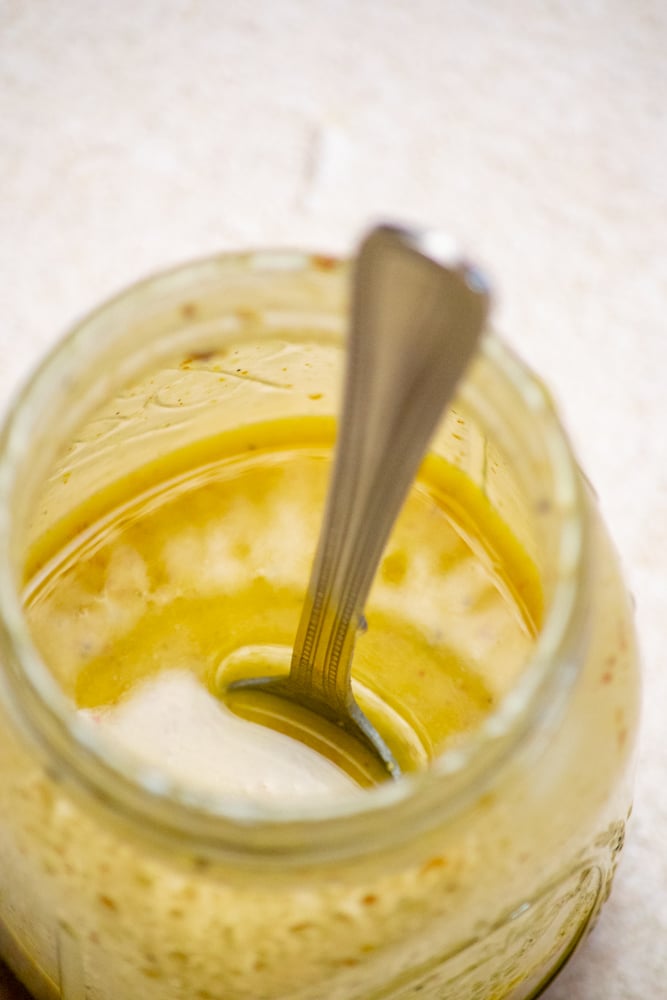 combine dressing ingredients in a mason jar or liquid measure