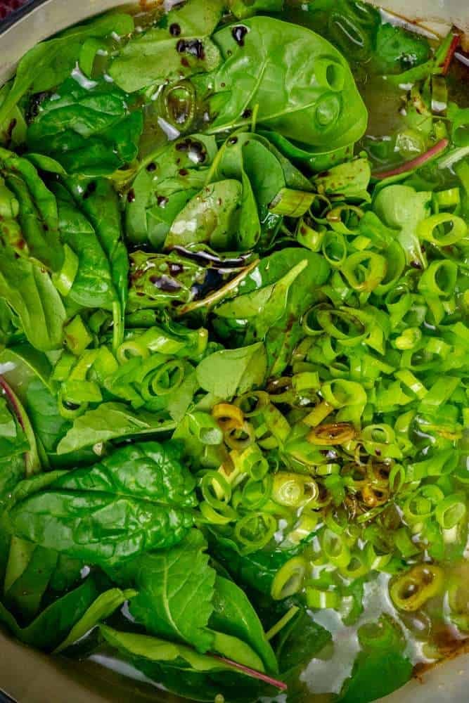 stir in greens, soy sauce, sesame oil, and mot of the scallion greens