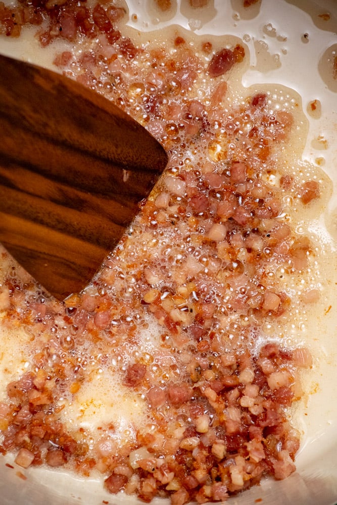 cook until rendered, then remove to a paper towel lined plate to drain