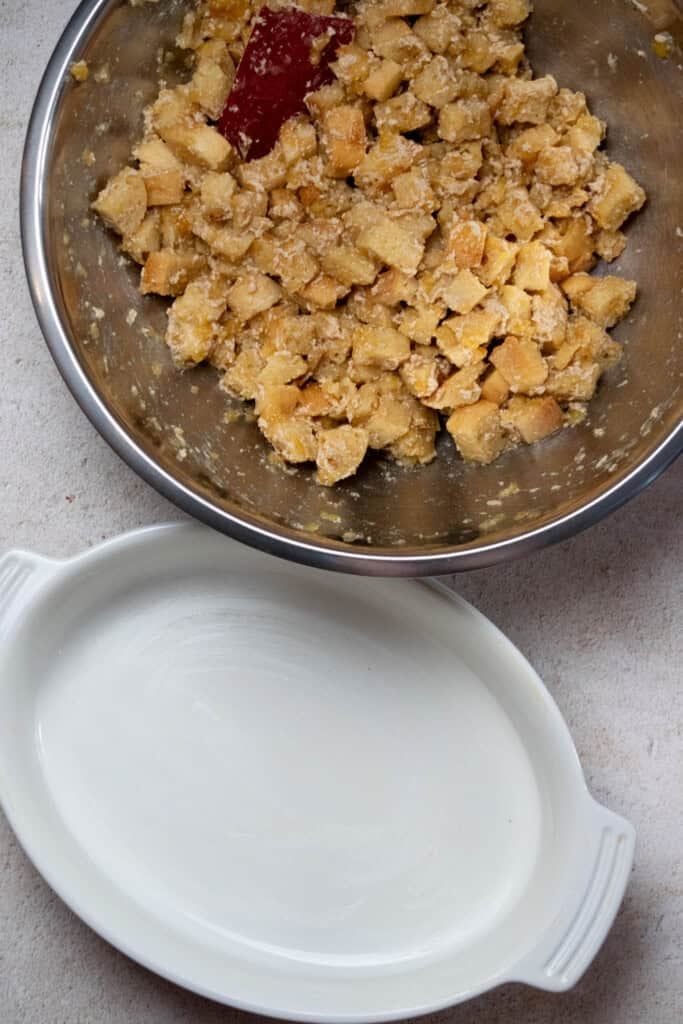 Grease a 9x13" ceramic baking dish with butter. Transfer the stuffing mixture to the dish.