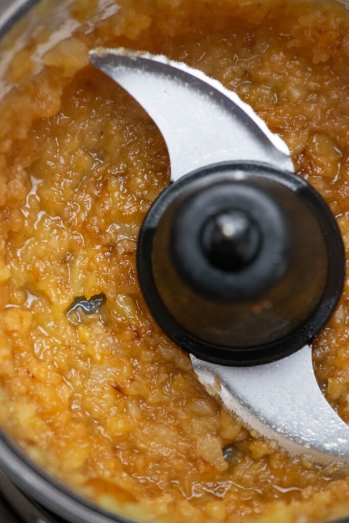 Pulse pineapple briefly in the food processor until it is slightly smooth, with some chunks remaining, about 10 seconds.