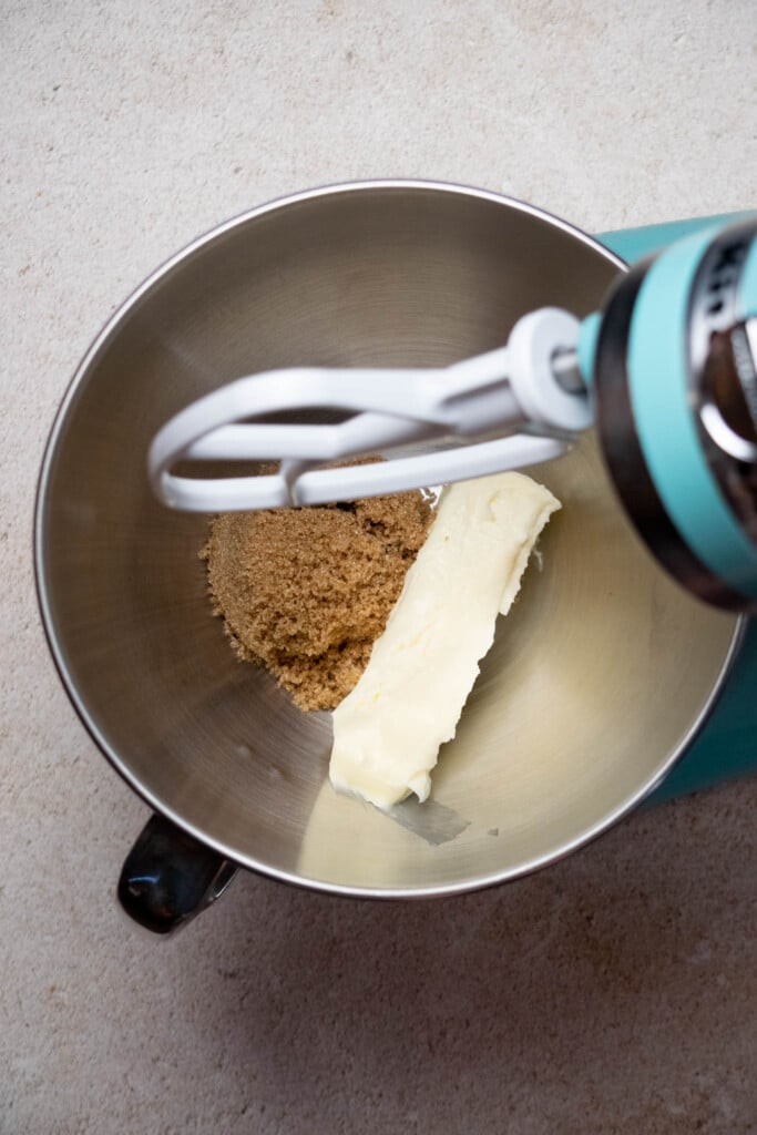 While the pineapple cools, cream together your butter and ½ cup brown sugar until lightened and fluffy, about 1 minute.