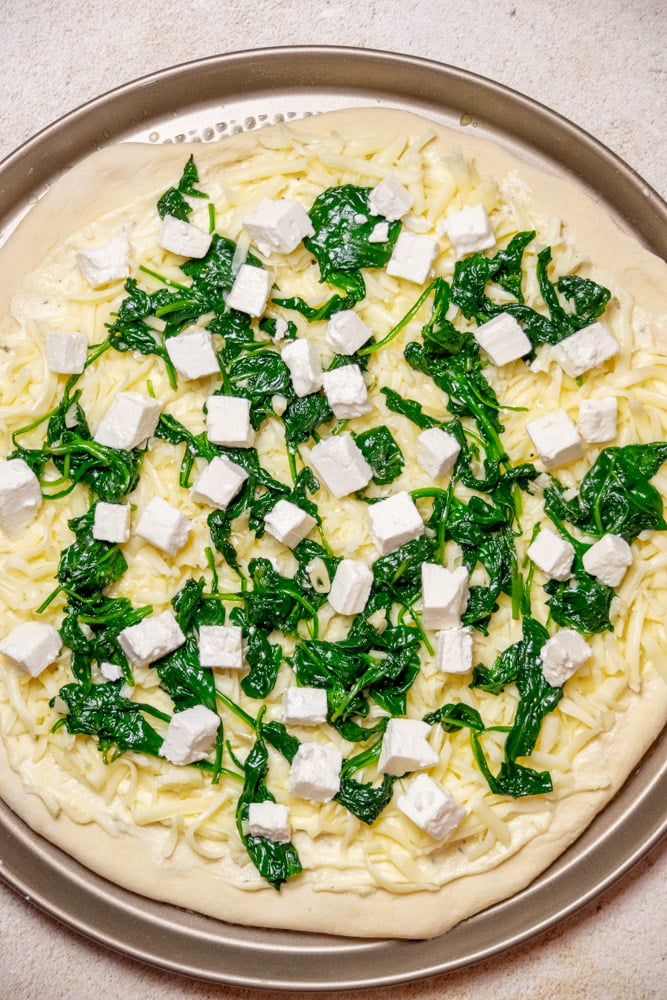 Next, add an even layer of the cubed feta cheese.