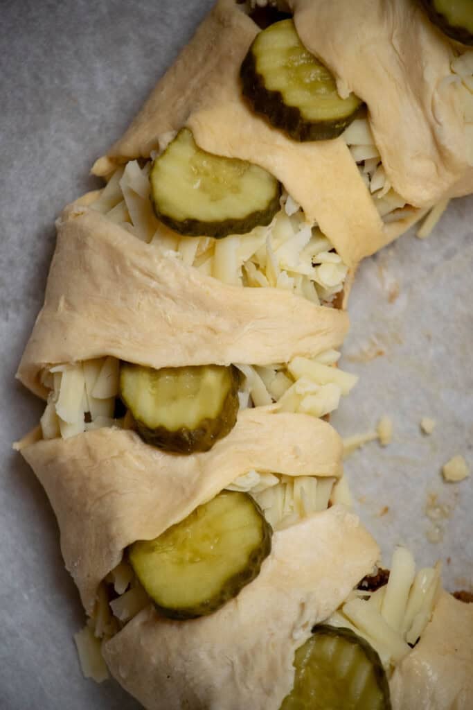 gently tuck the pickles under the crescent rolls in an even pattern. 
