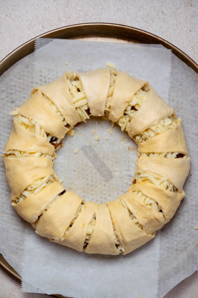 pull the outer edges of the crescent rolls gently up and over the filling, and press to seal at the center. 