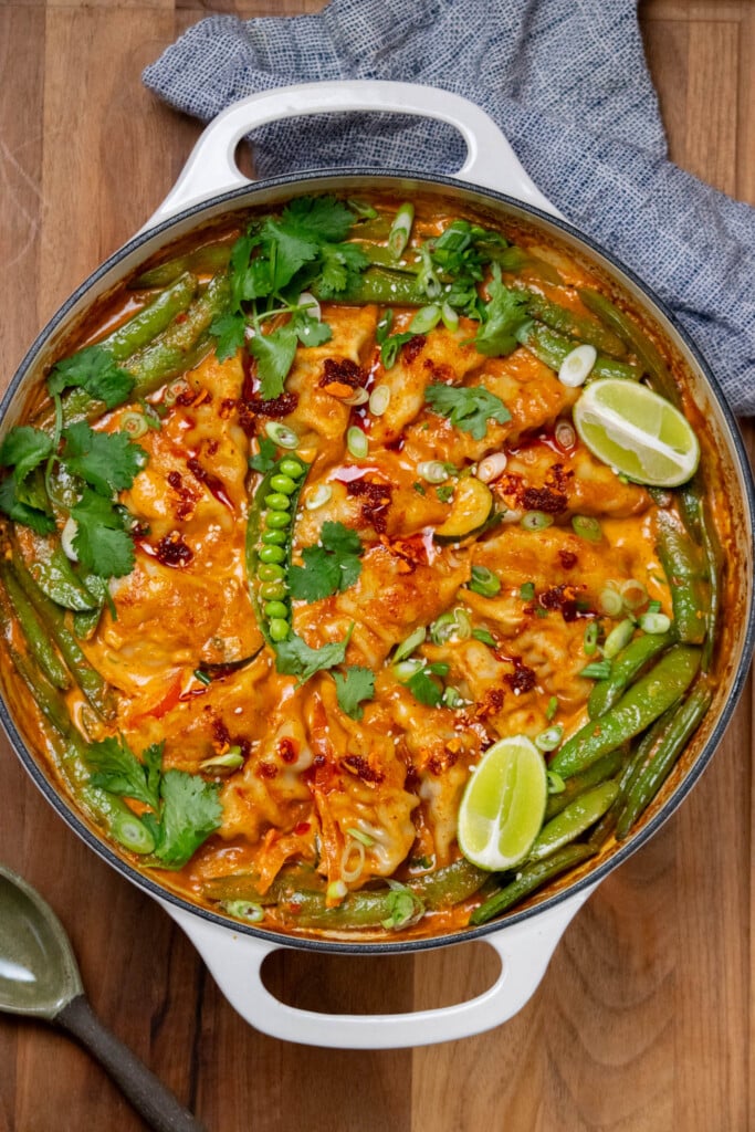 remove from oven and garnish with herbs, chili oil, and lime. 