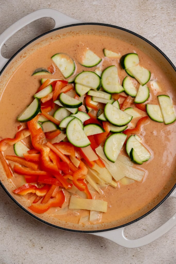 Once your sauce is well mixed, add your sliced bell pepper,. sliced zucchini, and drained bamboo shoots. 