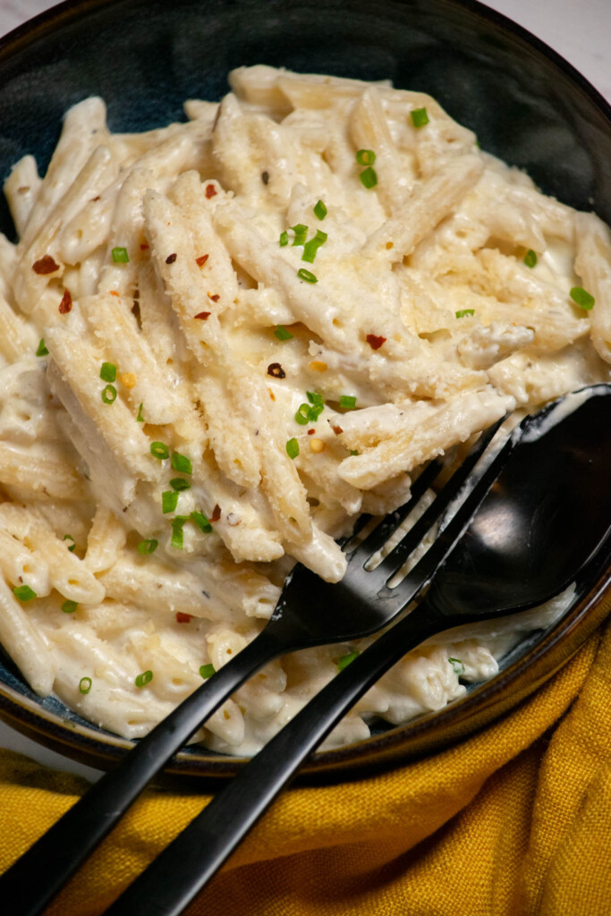 serve with chopped chives or parsley, crushed red pepper flakes, and additional grated parmesan. 