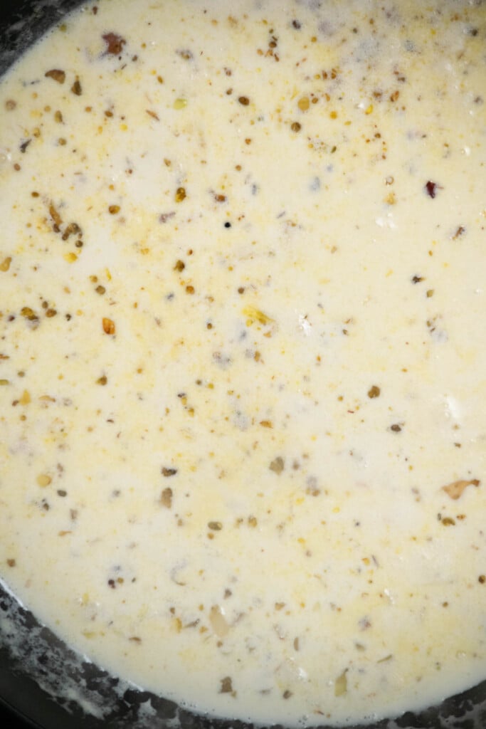 Pour in the heavy cream and chicken stock, and stir well. Cook for 2-3 minutes, until warm and bubbly. 