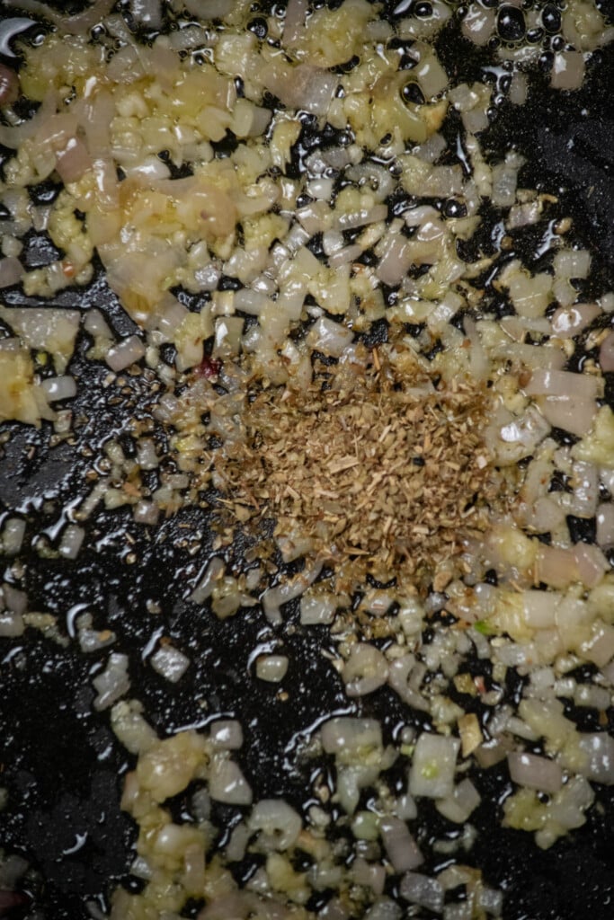 add oregano (if using), and stir. Cook 30 seconds, until just fragrant, to bloom the spice.