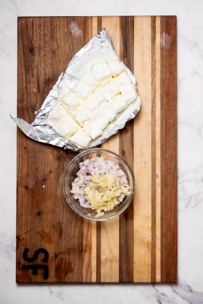 get your pasta boiling, and chop and minced your shallot and garlic. Cut softened cream cheese into small piece to make it easier to blend into the sauce.