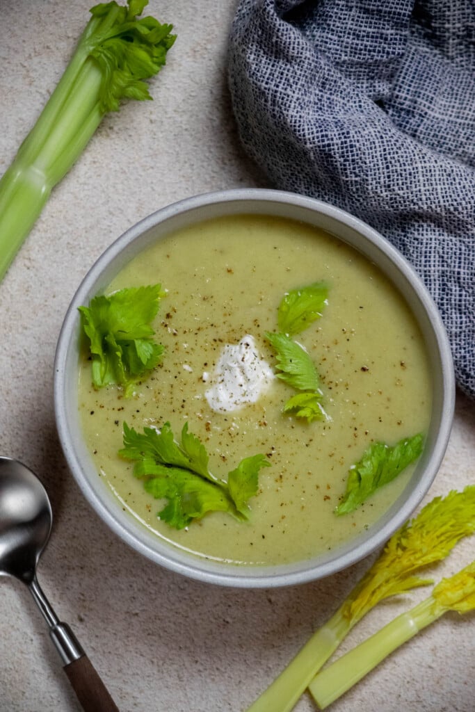 taste, and add salt and pepper as needed. Serve with a dollop of sour cream, Greek yogurt, or labneh, reserved celery leaves, and additional ground pepper. 