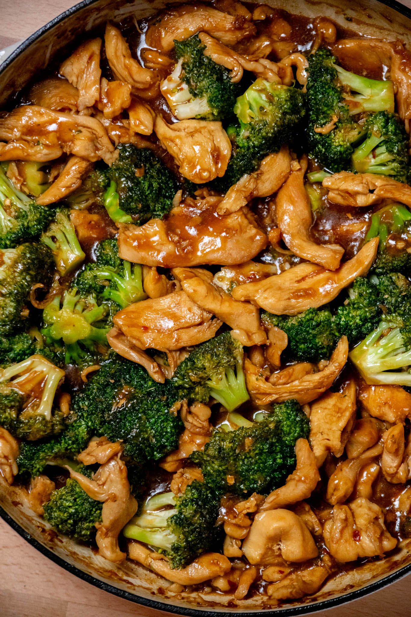 Finish the stir fry. Return the chicken and any accumulated juices to the skillet. Toss with the broccoli and sauce and cook over medium-low heat for about 2 minutes, until everything is heated through and the sauce is thick and glossy.