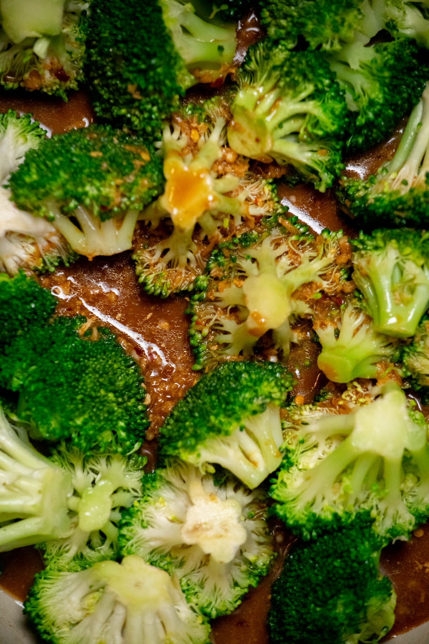 Cook the broccoli. Add the broccoli to the skillet in an even layer. Add the water and scrape up any browned bits from the bottom of the pan. Pour in the sauce, cover, and cook over medium-low heat for 3–5 minutes, until the broccoli is crisp-tender.