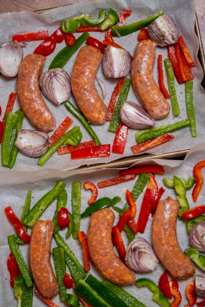 line one large sheet pan, or 2 half sheet pans with parchment paper, and arrange sausage links and veggies in an even layer