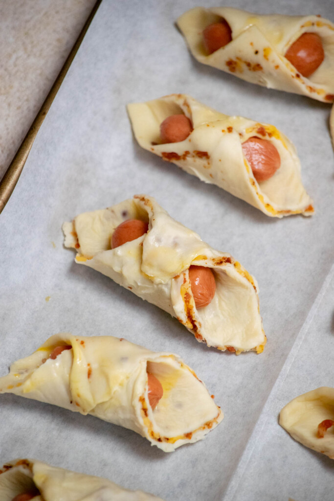 transfer the pigs in a blanket to the freezer for 20 minutes to firm up the puff pastry. 