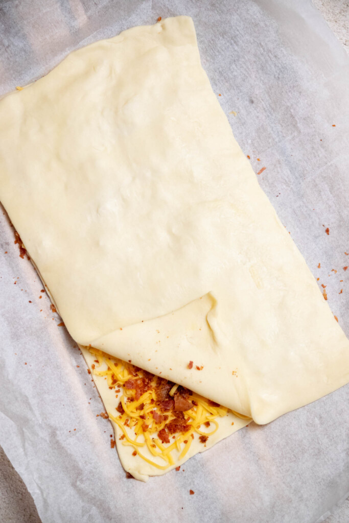 cover with the other cut half of the puff pastry. 