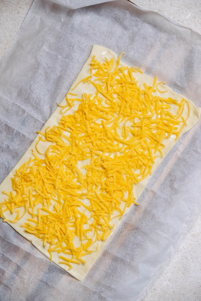 layer on half a cup of shredded cheddar in an even layer 