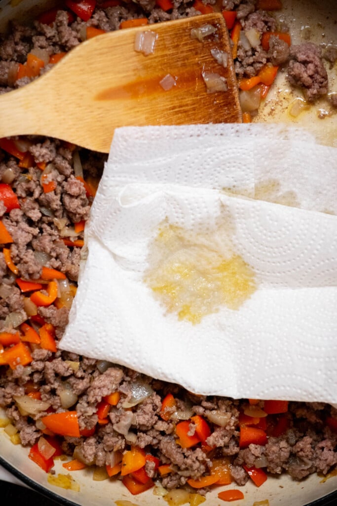 Use paper towels to drain off the excess grease from the skillet 