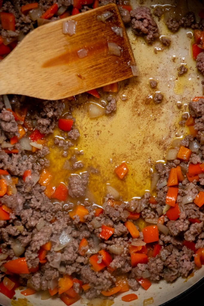 cook beef, breaking up as you go, until cooked through, and no pink remains 