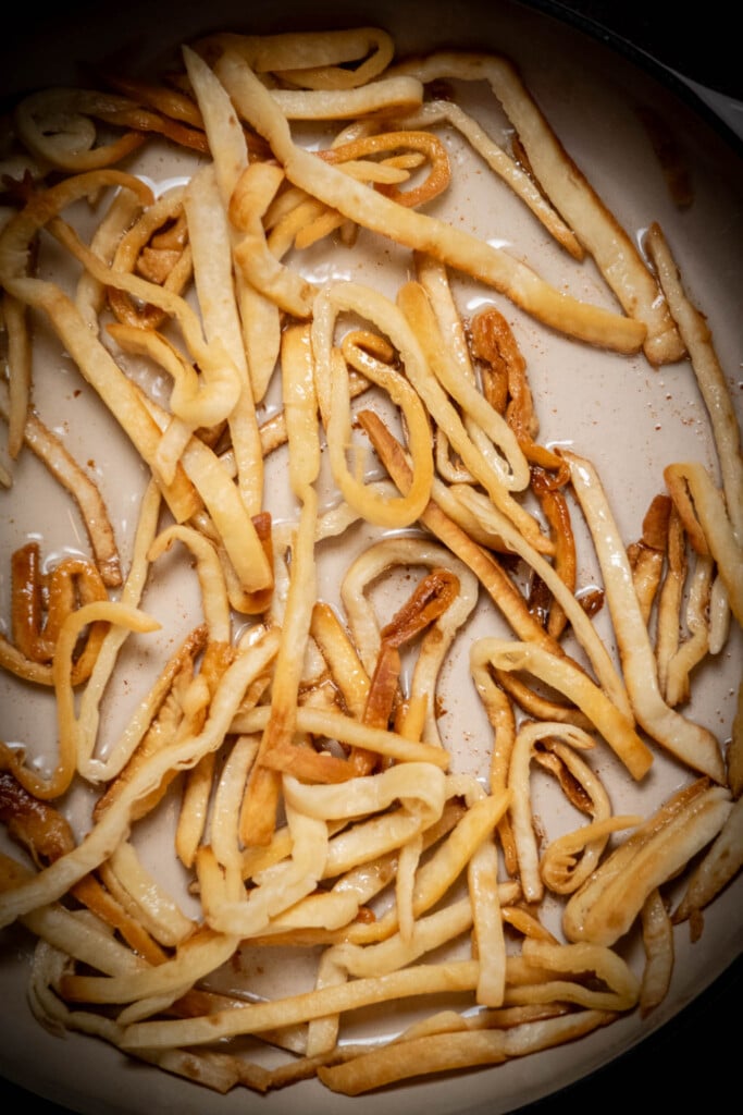 fry the tortilla strips, moving them around and flipping, until golden brown and crisp, about 3 minutes