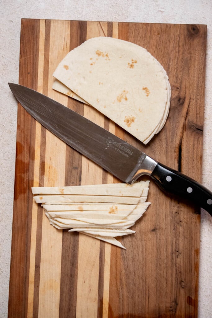 Preheat your oven to 450 degrees f. slice your tortillas into thin strips (about &frac14;" thick)