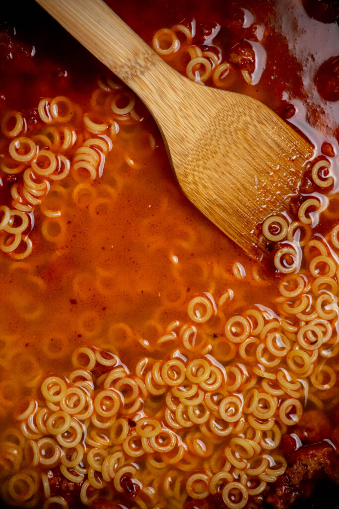 add the chicken stock and pasta, and bring to a boil over high heat. 
