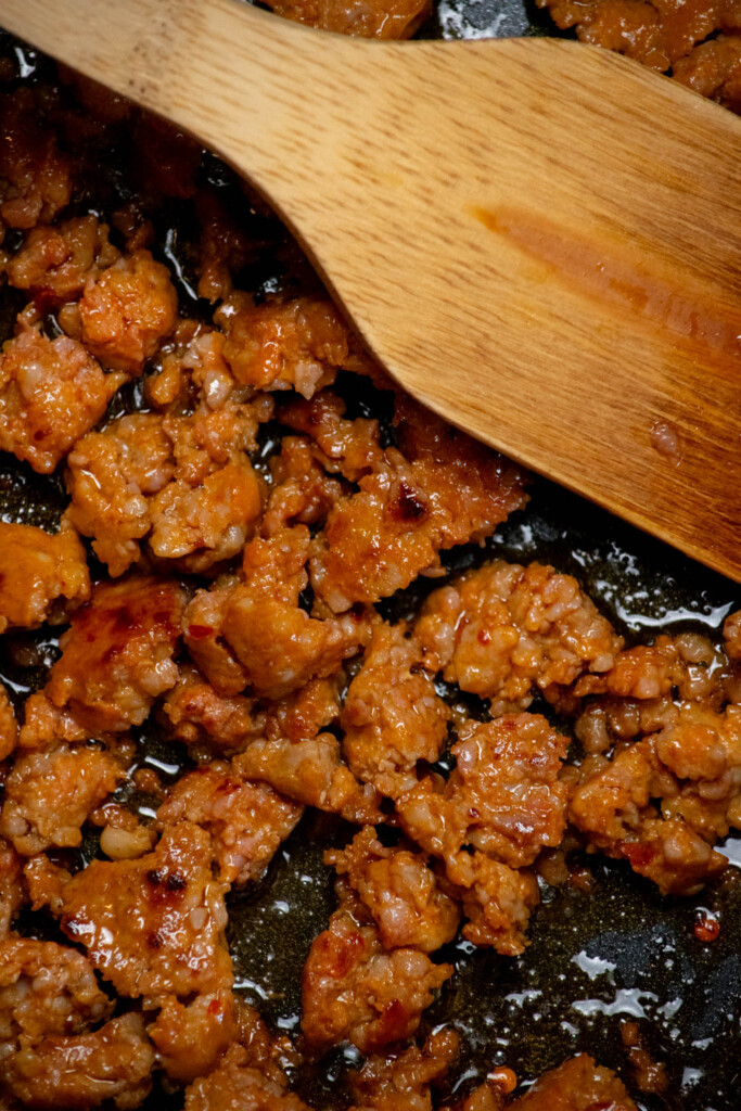 cook sausage, breaking up as you go, until slightly browned, and no pink remains. 