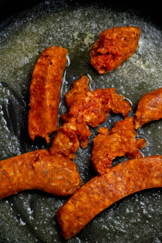 remove sausage casings and discard. Add loose sausage a large deep saut&eacute; pan with melted butter