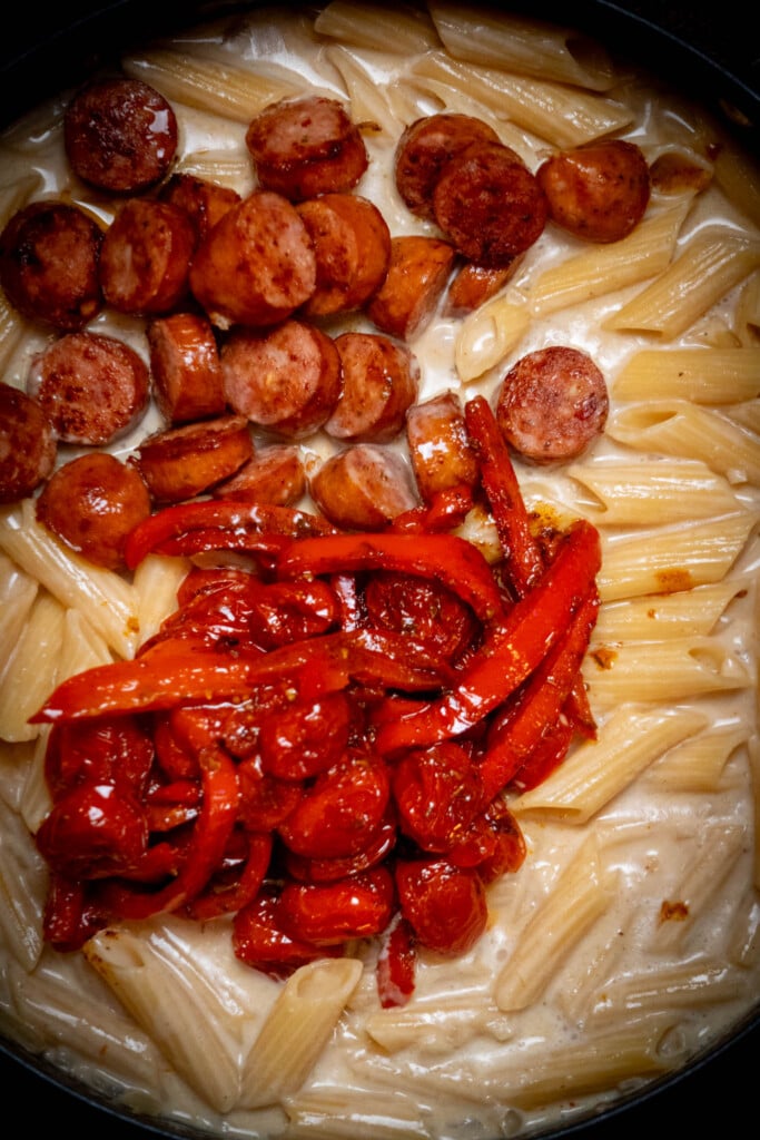 add reserved browned sausages and roasted veggies (and any accumulated juices) to the pot with the pasta. 