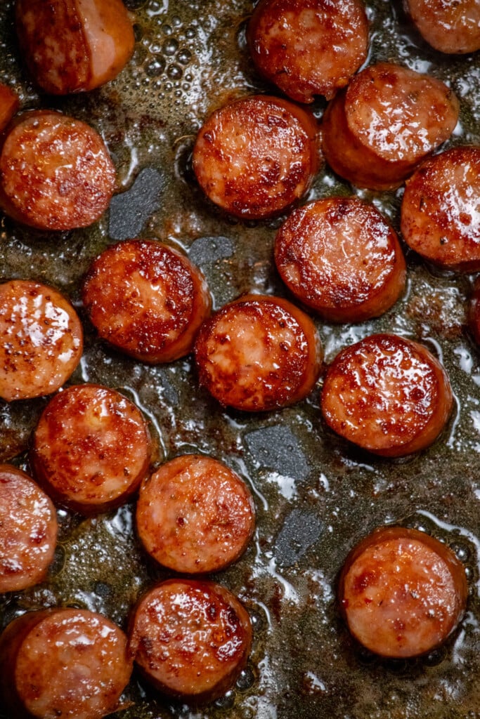 Once sausages are well browned, remove to a plate and set aside. 