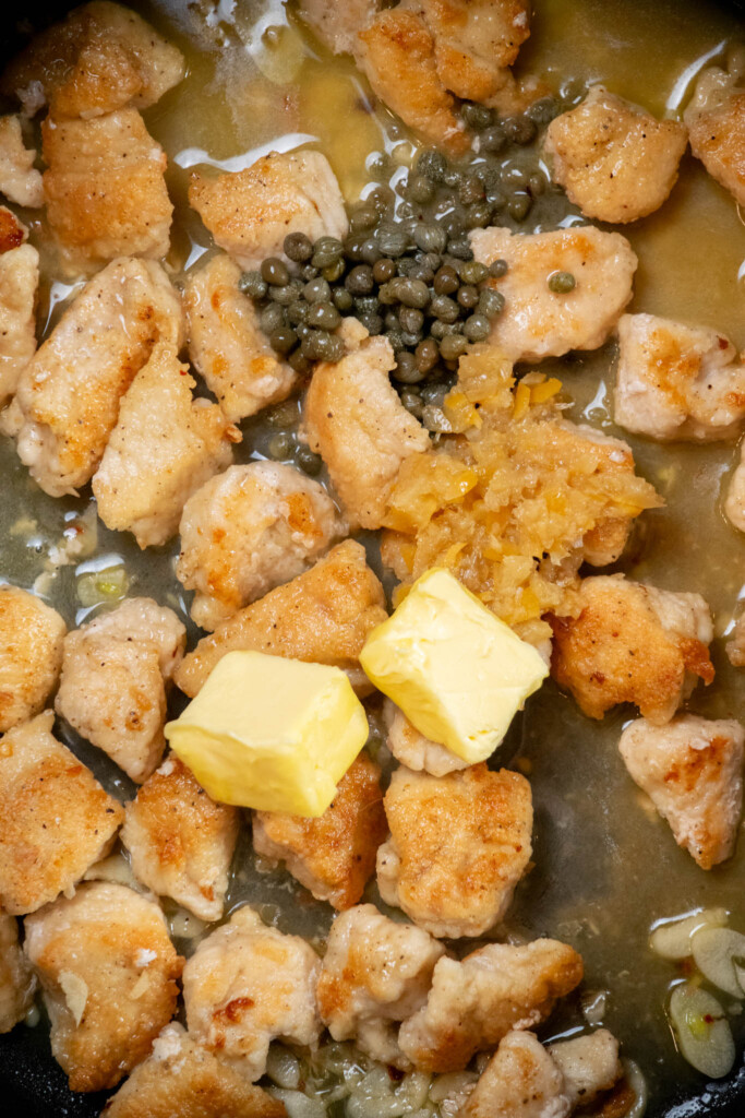 Turn off the heat, and add reserved cold butter, lemon juice, preserved lemon (if using) and capers. 