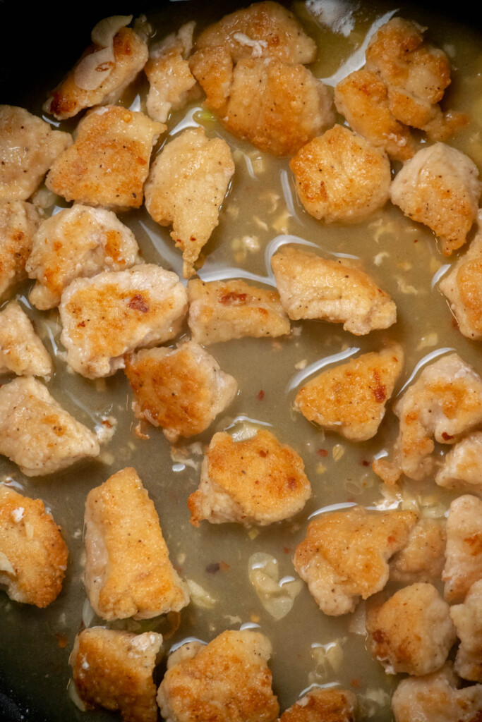 Add all the chicken back to the pan, toss to coat, and cook about 2 minutes to warm through and begin thickening the sauce 