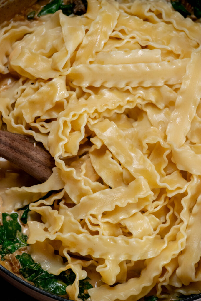 With the heat off, stir in the drained cooked pasta 