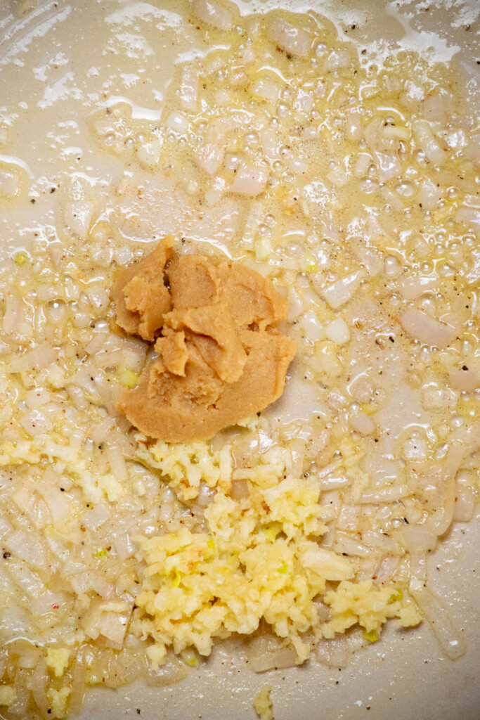 add the garlic and miso paste, stir well, and cook for 1 minute, until fragrant 