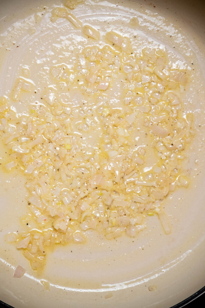 Get your pasta going in a large pot of salted water, cook to al dente, and drain, reserving 1 cup of pasta water. Melt butter in a large skillet, and cook shallot for 2-3 minutes, until softened 