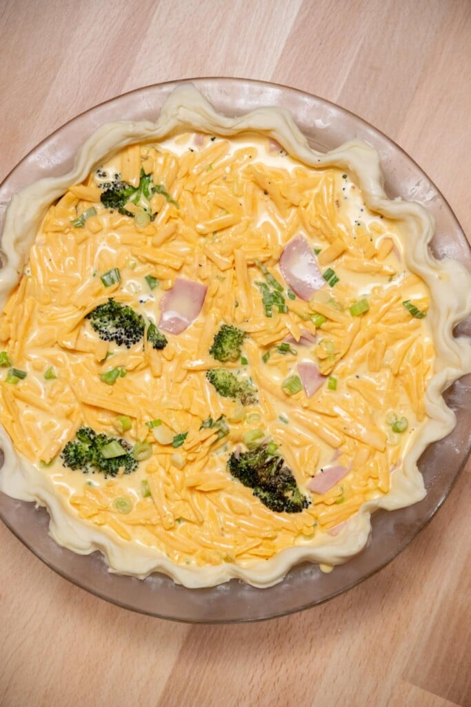 Pour the egg mixture over the ham and broccoli.