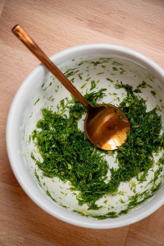 Make the Dill Gremolata by mixing minced dill, garlic, lemon zest and olive oil in a small bowl. Set aside. 