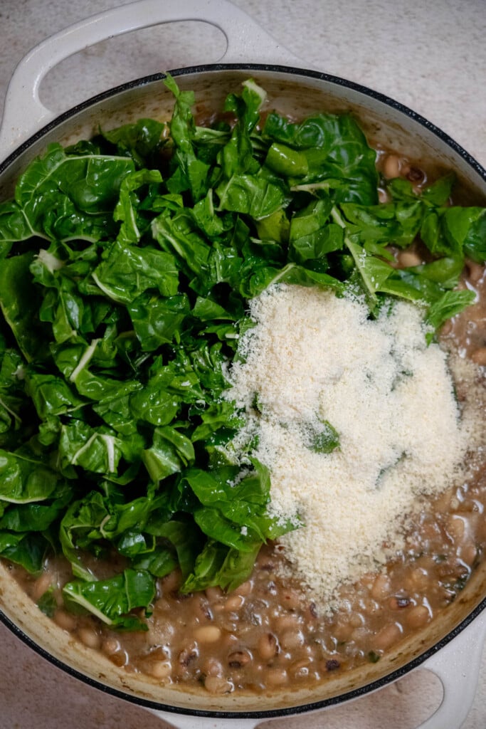 Stir in the Swiss chard leaves and parmesan cheese 