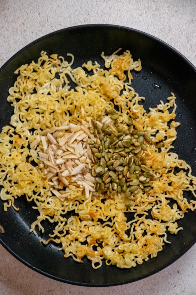 Add the slivered almonds and pepitas, and toss to coat. fry 1 minute, being careful not to burn, as they will toast quickly. 