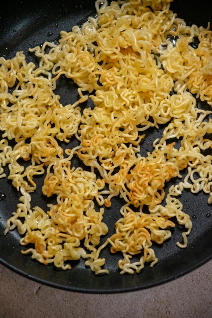 Fry noodles undisturbed on first side for 3-5 minutes, until the edges turn golden, then flip over and fry 3-4 minutes on the other side. 