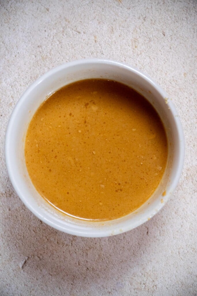 The dressing should be smooth, with no bits of peanut butter remaining. Shaking really helps with this, or slightly warming the peanuit butter for a few seconds in the microwave before whisking in the other ingredients. 
